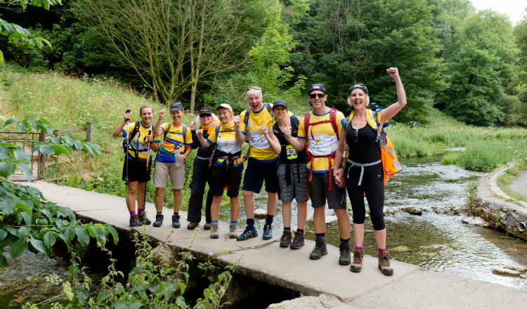 Group of walkers on clapper bridge