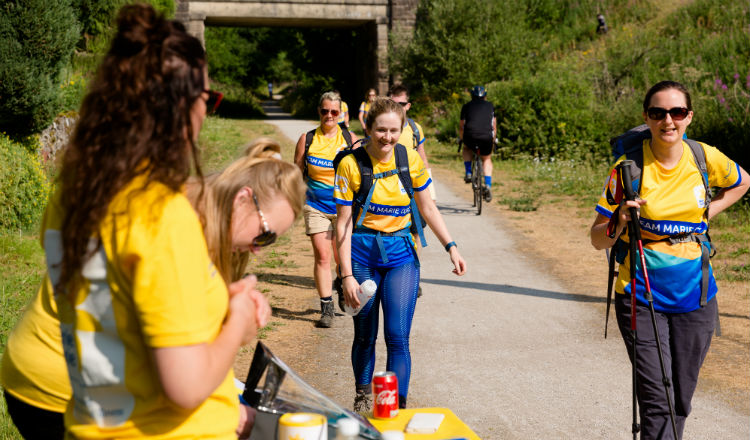 Walkers approach water station