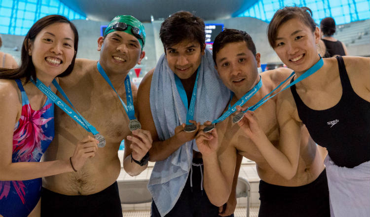 Group of students at Swimathon 2018 in support of Marie Curie and CRUK