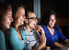 Group of friends watching a film at Cinema Night